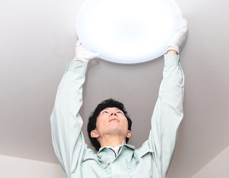 Male,Worker,Inspecting,Lighting,Fixtures